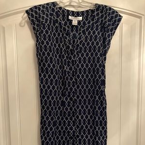 Small navy maternity blouse with tie in back.